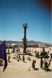 Figure 8: Participants climb a sculpture near Center Camp. Photograph by author.